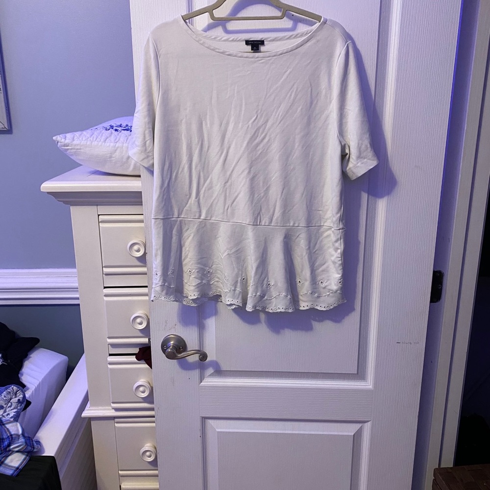 Off white shirt that comes in at the waist